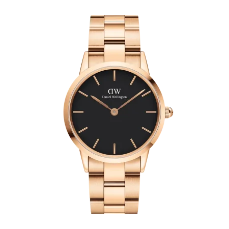 Daniel Wellington watch featuring a round shape, a pink strap, and a black dial.